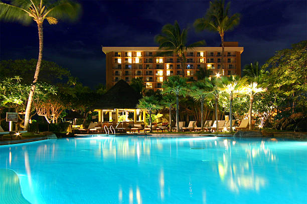istock A swimming pool outside of a hotel at night 92230694
