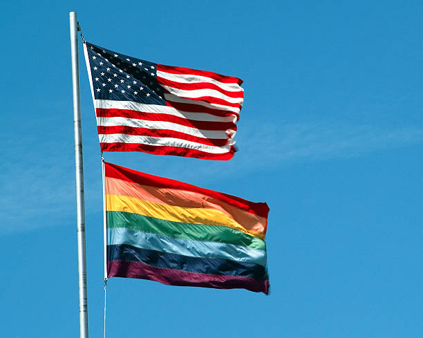 Passeata Gay e bandeiras da América - fotografia de stock