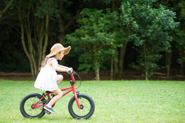 istock Little girl riding a bicycle 922311688