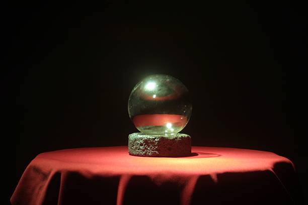 istock Crystal ball on red table with black background 92231213