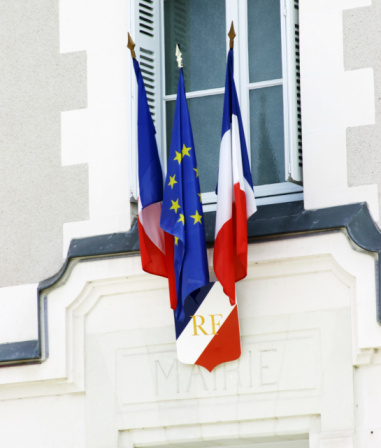 French tricolor flag on wall of mayor office