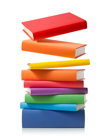 Stack of colored books on white background.