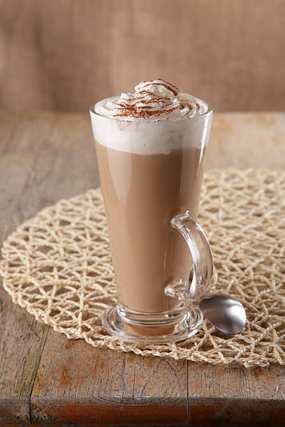 istock coffee latte macchiato with cream in glass on old table 92232311