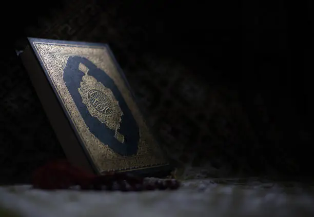 Quran - holy book of Muslims around the world put on wooden boards
