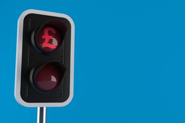 istock Red traffic light with pound symbol currency 922329938