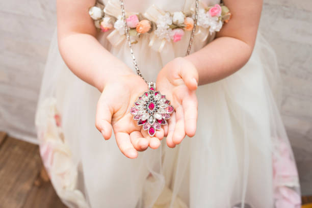 istock Little girl with necklace 922338452