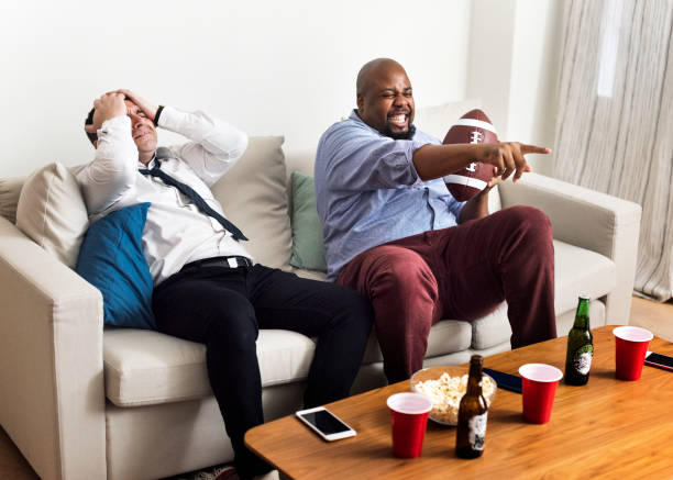 istock Friends cheering sport league together 922342036