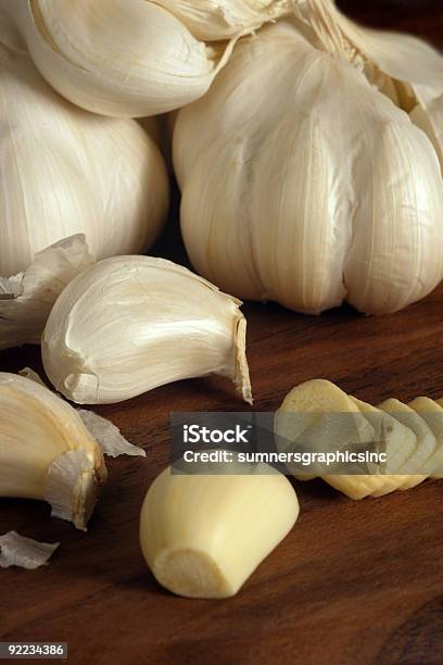 Cloves And Sliced Garlic Stock Photo - Download Image Now - Close-up, Clove - Spice, Color Image