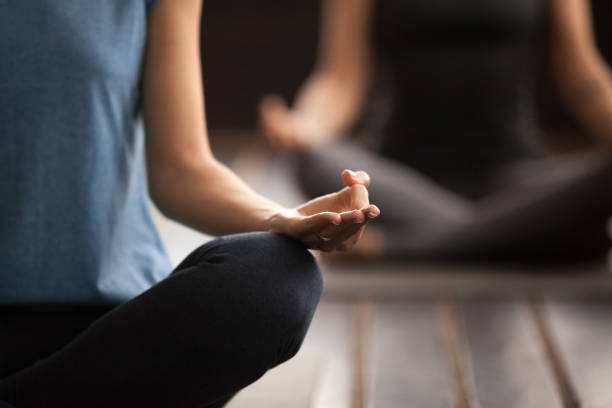 istock Hand mudra gesture close up, people in Sukhasana pose 922344930