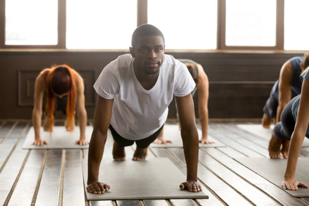 istock Young sporty black man in Plank pose 922344970