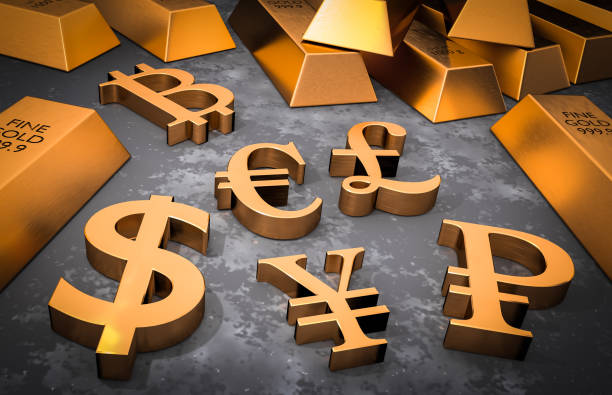 istock Golden currency symbols and gold bars 922352306