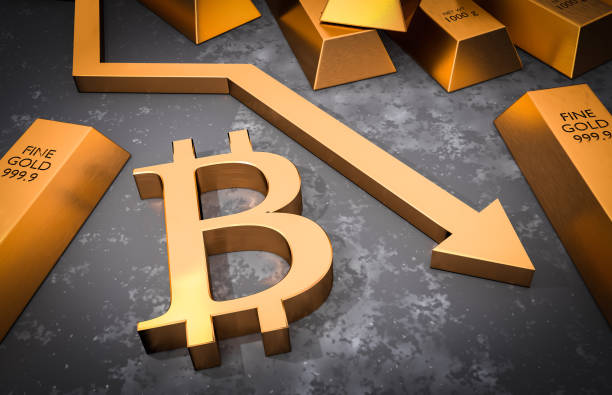istock Golden bitcoin symbol and golden arrow down 922352340