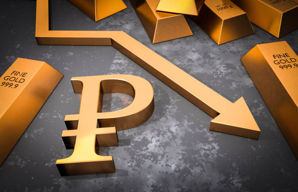 istock Golden ruble symbol and golden arrow down 922352478