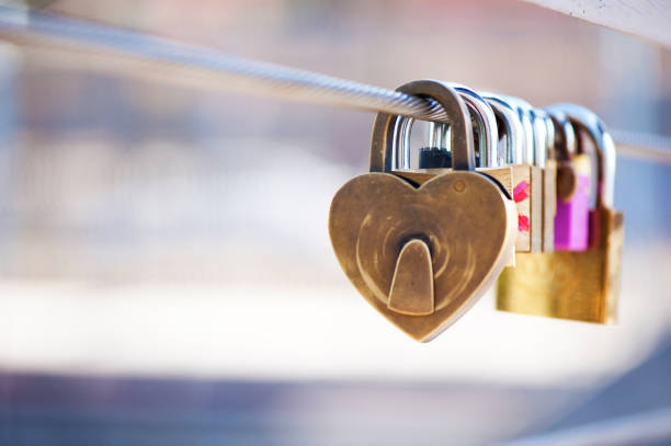 istock Heart padlock on a fence 922352506