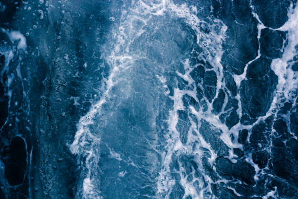 istock Abstract blue background with white veins, ocean wave, bubble and foam, pattern 922352744