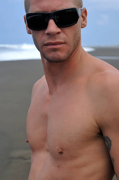 istock sexy man at the beach 92235296