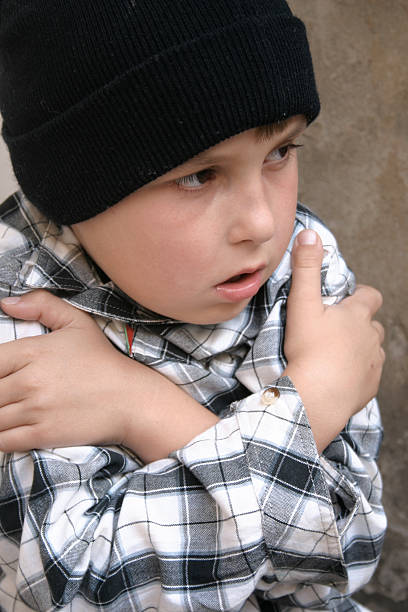istock Young boy shivering cold and lonely 92235425