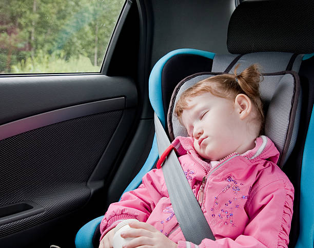 istock Little girl sleeping  in a car 92235480