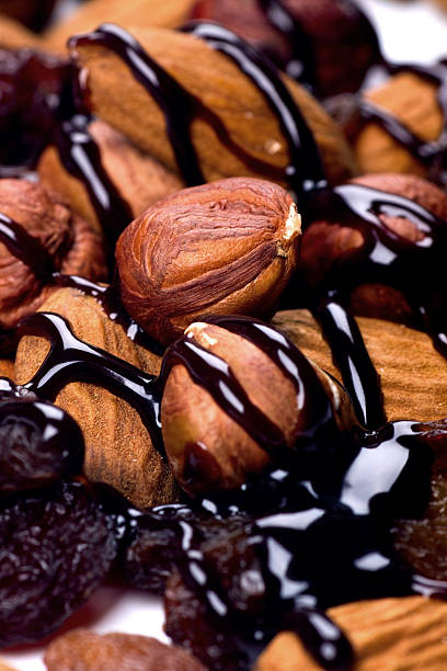 istock Hazelnuts, almonds and raisins with chocolate topping 92235874