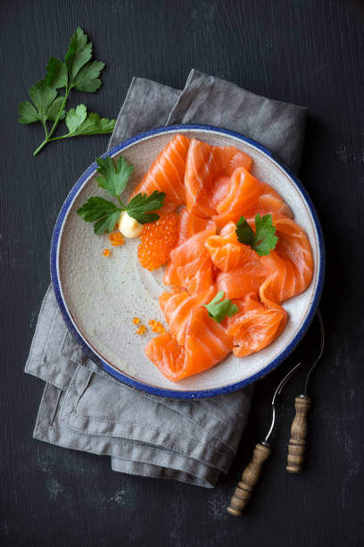 Smoked salmon slices with caviar