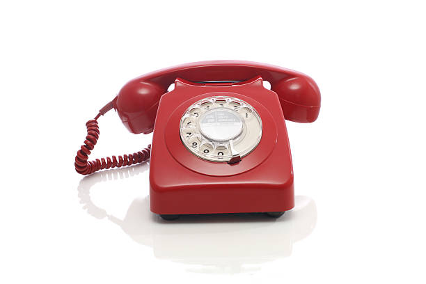 istock Classic Red Plastic Rotary Dial Telephone Receiver On White 92236102