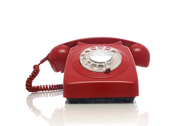 istock Classic Red Plastic Rotary Dial Telephone Receiver On White 92236104