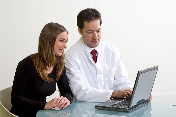 Laptop, woman and doctor stock photo