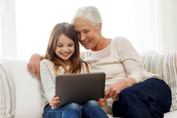 istock smiling family with tablet pc at home 922363550