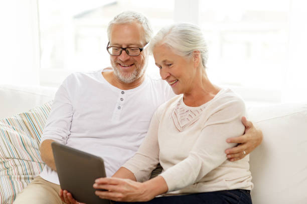 istock happy senior couple with tablet pc at home 922368222