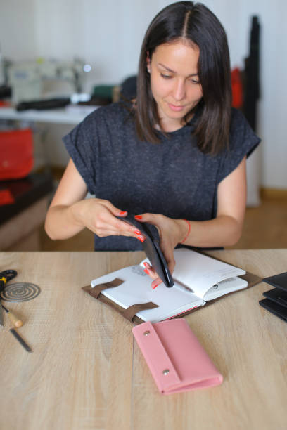 istock Young woman making bag at sewing cir 922369236