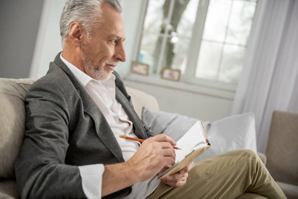 istock Profile photo of attentive man while writing 922371584