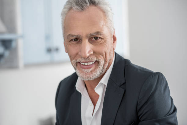 istock Positive delighted businessman posing on camera 922371986