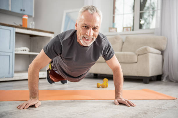 istock Happy man doing sport at home 922372484