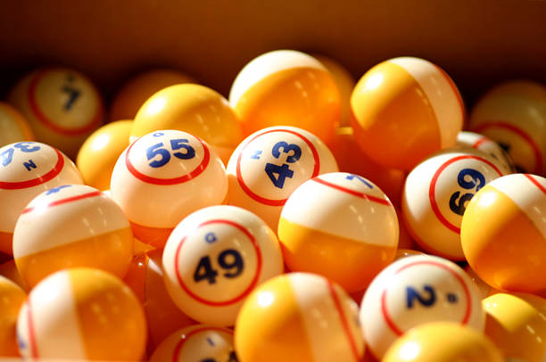 Many orange and white bingo balls stock photo