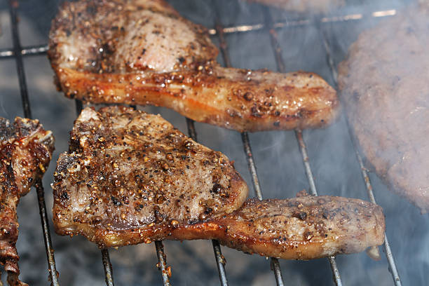 istock bbq spiced juicy lambs chops on griil with smoke barbeque 92237307