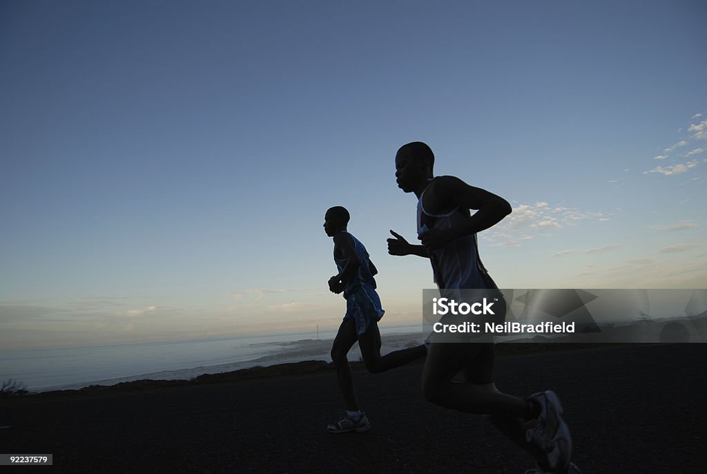 Dawn de ejecución - Foto de stock de Carrera de carretera libre de derechos