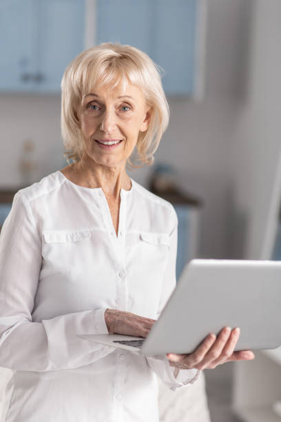istock Appealing mature woman learning online 922376490