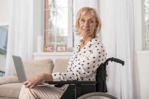 istock Disabled mature woman working online 922379824