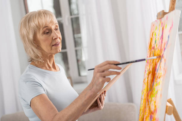 istock Talented mature woman involving in drawing 922380298