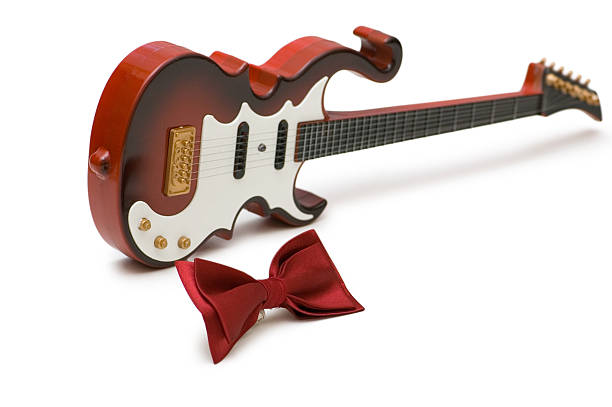 istock Guitar and bow tie isolated on the white 92238224