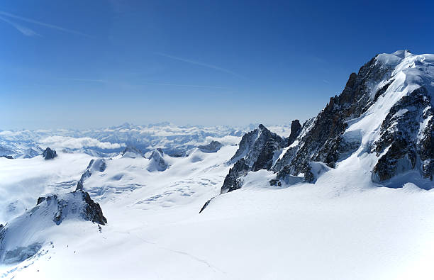 istock Blue sky above peak and clouds, the Alps 92238300