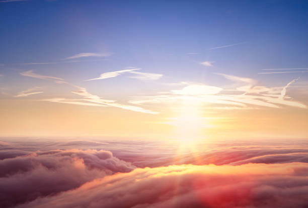 istock Beautiful aerial view above clouds with sunset. 922383280