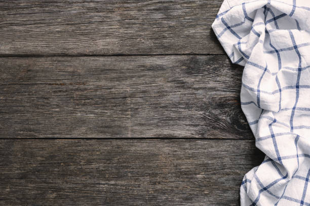 istock Textile on old wooden background with copy space for text 922383976
