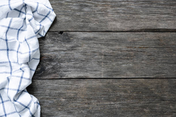 istock Wooden backdrop with kitchen textile. Food background 922383994