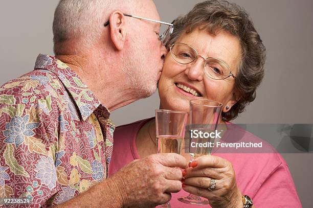 Happy Senior Couple Toasting Champagne Stock Photo - Download Image Now - Active Seniors, Adult, Adults Only