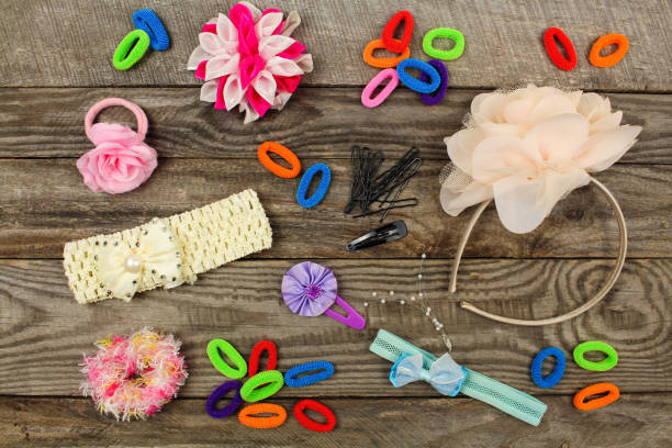istock Different hair clips on wooden background. Top view. 922387934
