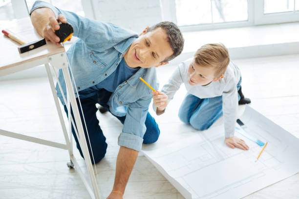 istock Pleasant man measuring the leg of table 922391936