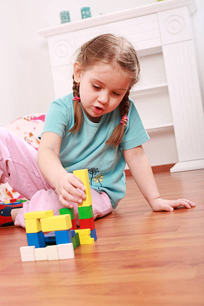 istock Adorable girl playing with blocks 92239333