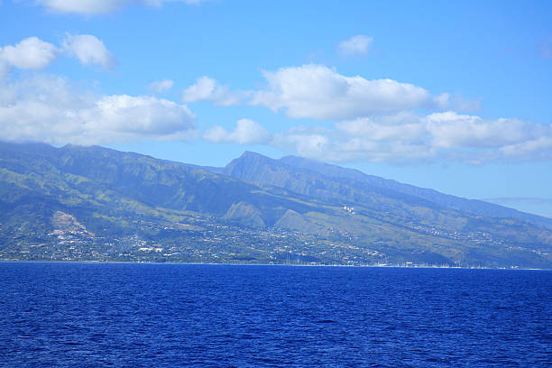 Beautiful Maui landscape in Hawaii featuring a sandy beach, turquoise sea, and lush greenery