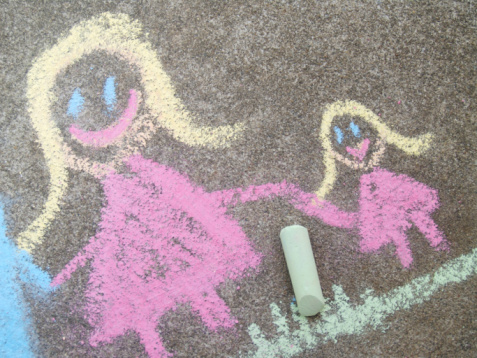 Chalk drawing of a mom and daughter.